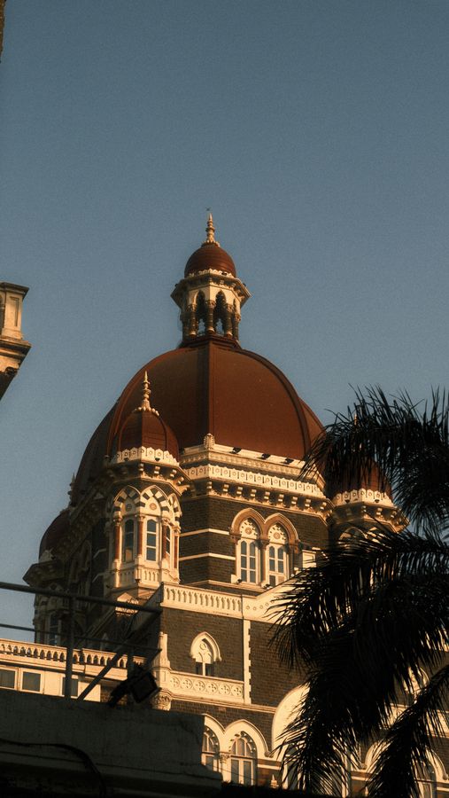 A red-domed heritage building in warm afternoon light